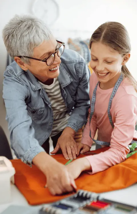 A grandmother and child working together